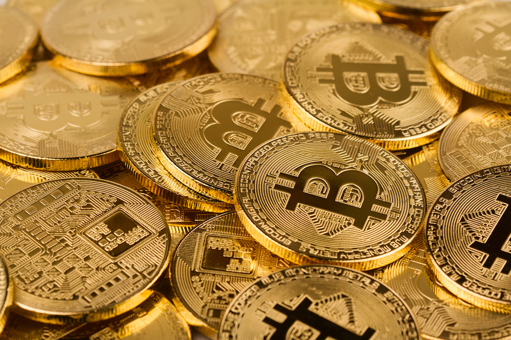pile of golden bitcoins background texture